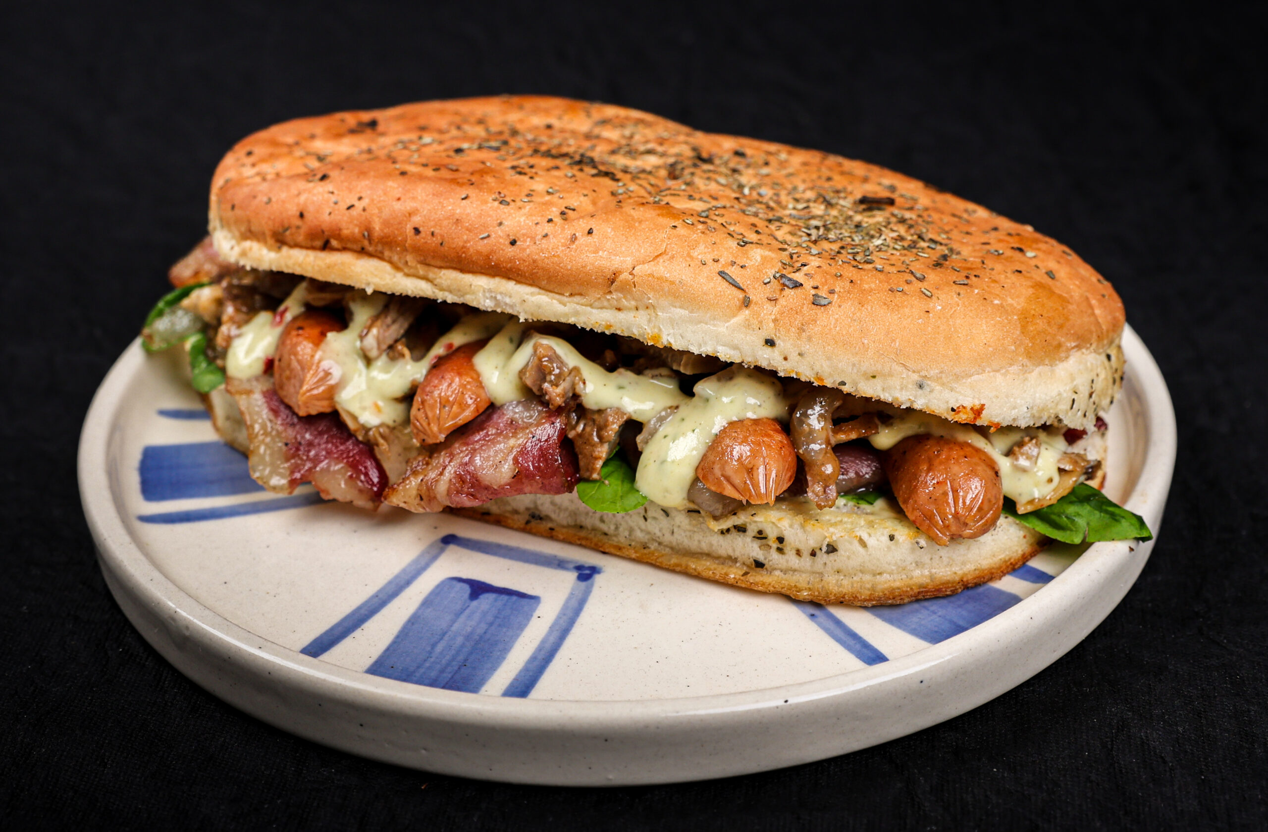 Piggy Fiesta Panini Sandwich with bacon, pulled pork, sausages and rocket in garlic butter – Tavora Bandra West