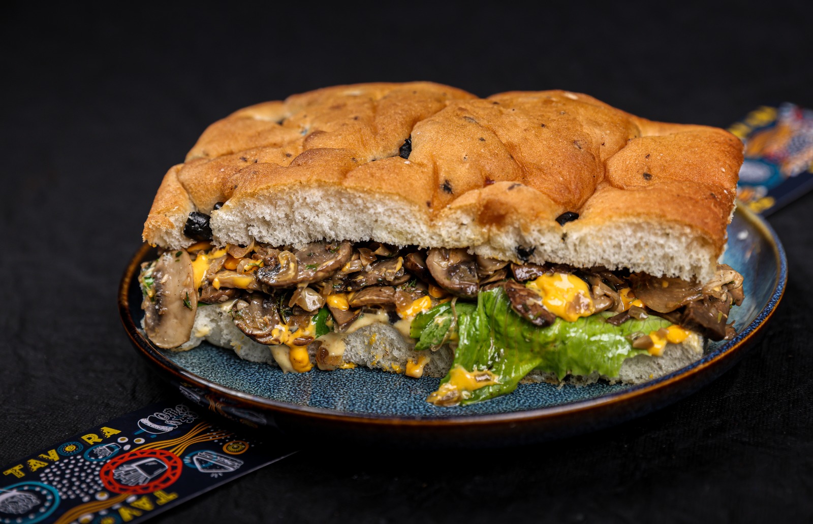 Smoked Wild Mushroom and Cheddar Cheese Sandwich with garlic aioli and cheddar sauce – Tavora Cloud Kitchen